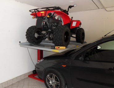 Quadbike lifted and car parked